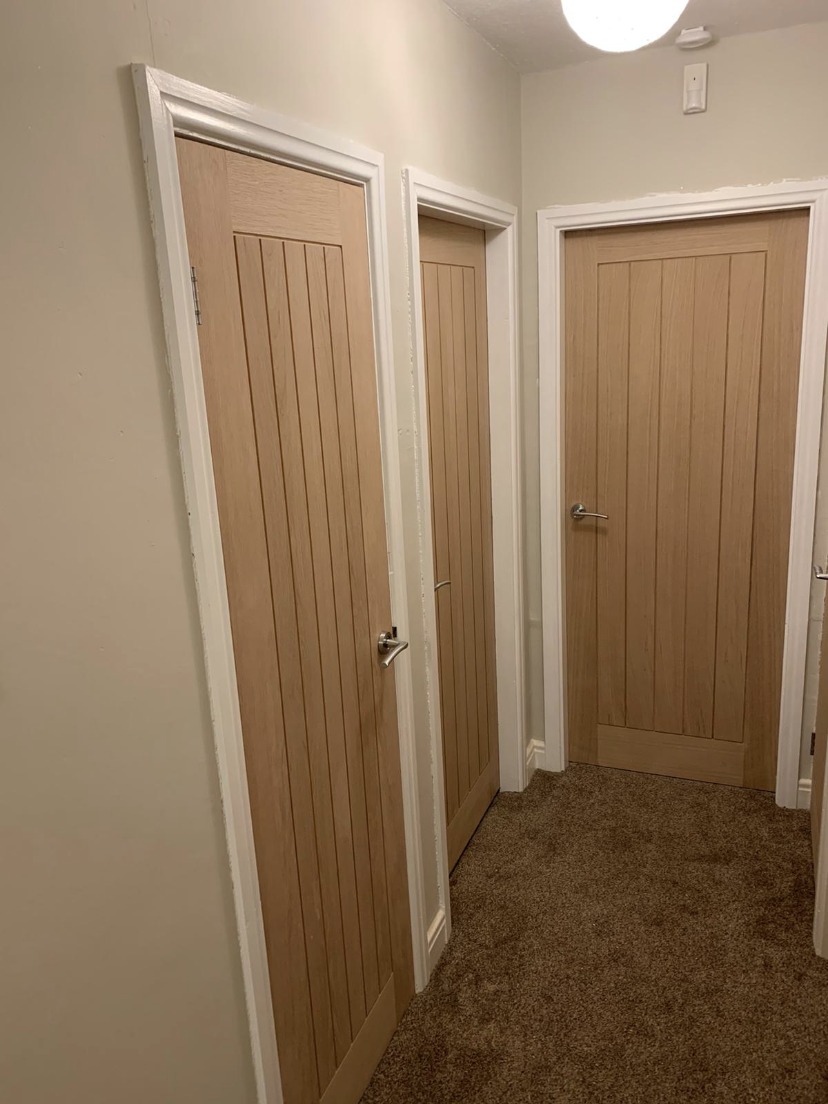 Hallway with new oak internal doors fitted