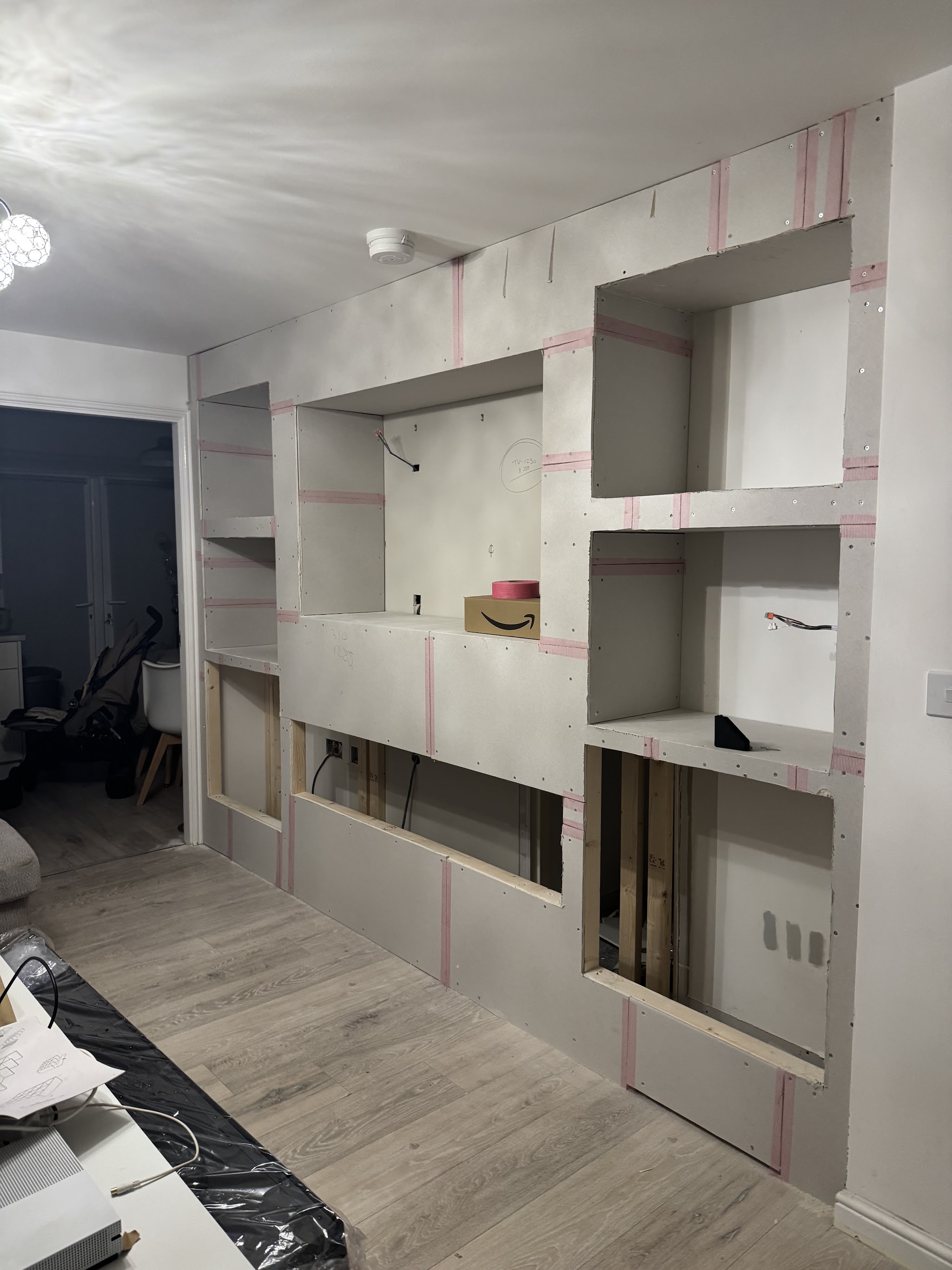 Media wall boarded out, alcoves formed, ready for finishing