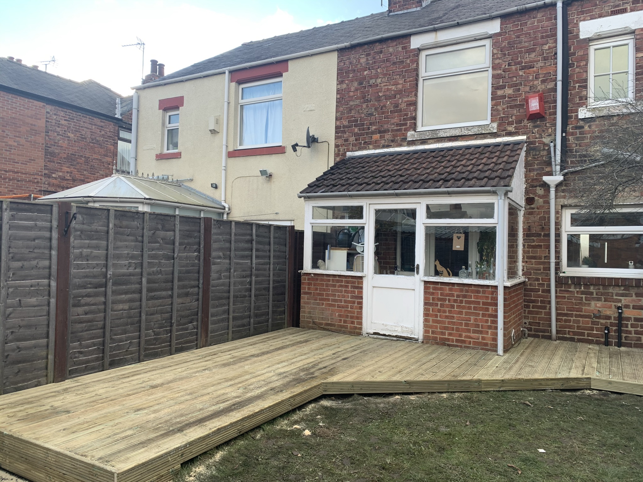 New timber decking across a back garden