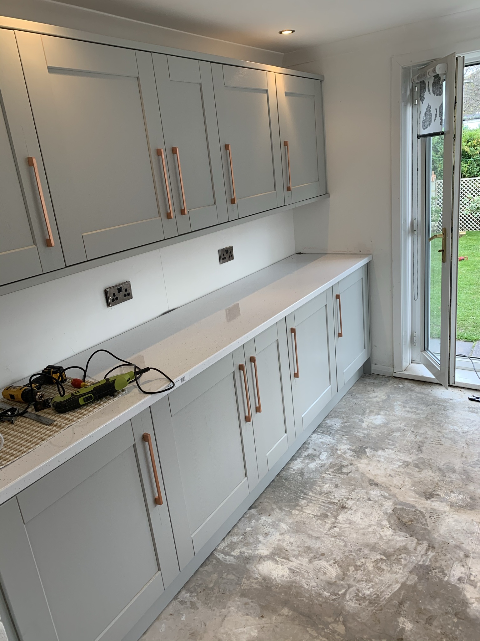 Grey shaker kitchen units and worktops fitted